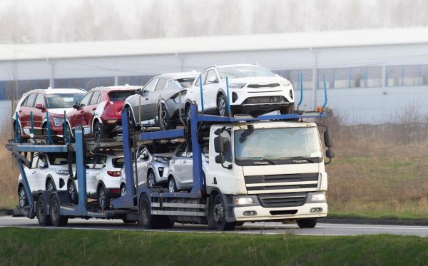 car-carrier-truck-transporting-new-cars-sale_782515-16134