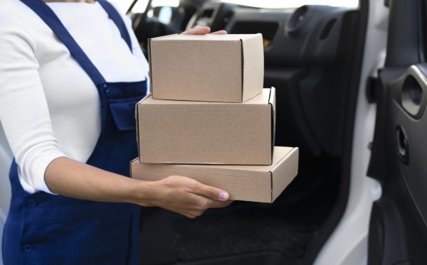 side-view-woman-carrying-boxes_23-2149908132